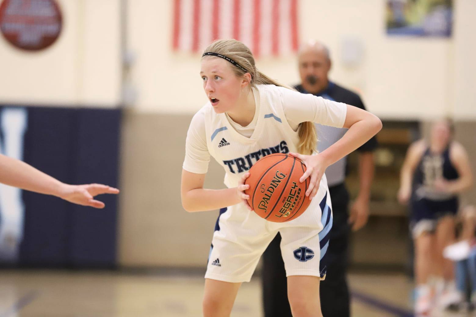 Tritons open league play with win