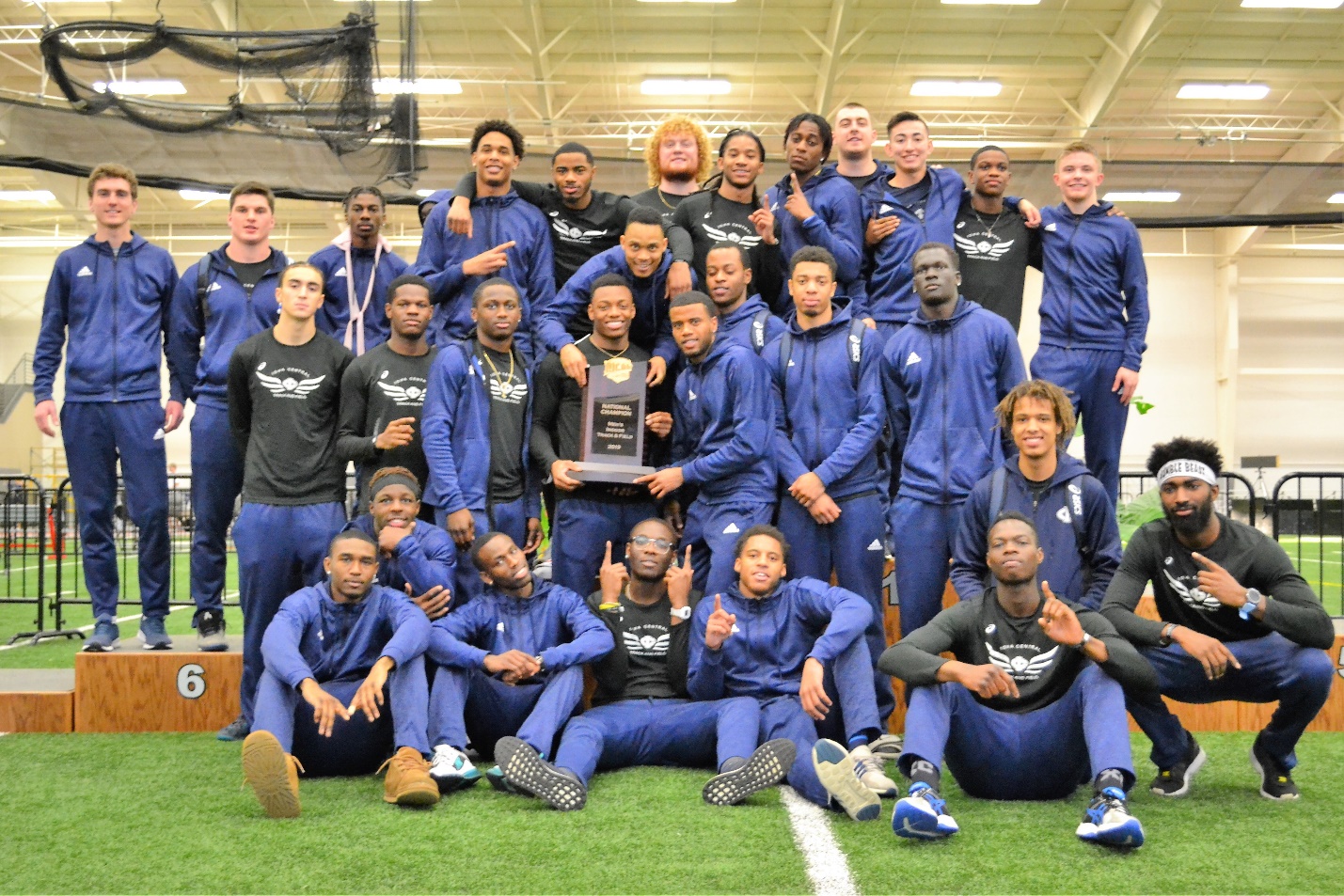 A group of football players posing for a photo Description automatically generated